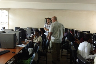 Hamilton (center) on a previous trip to Uganda